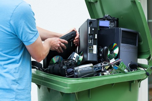 Professional house clearance staff working in a North London home