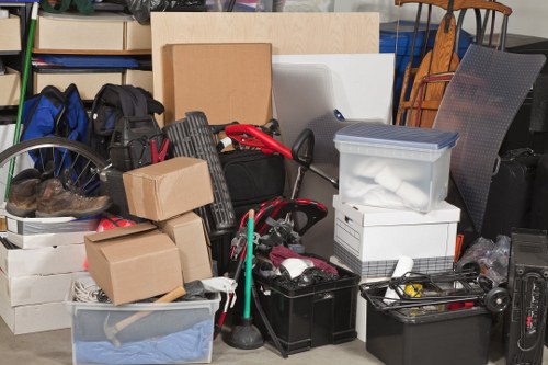 Loading items onto a clearance company's van in North London